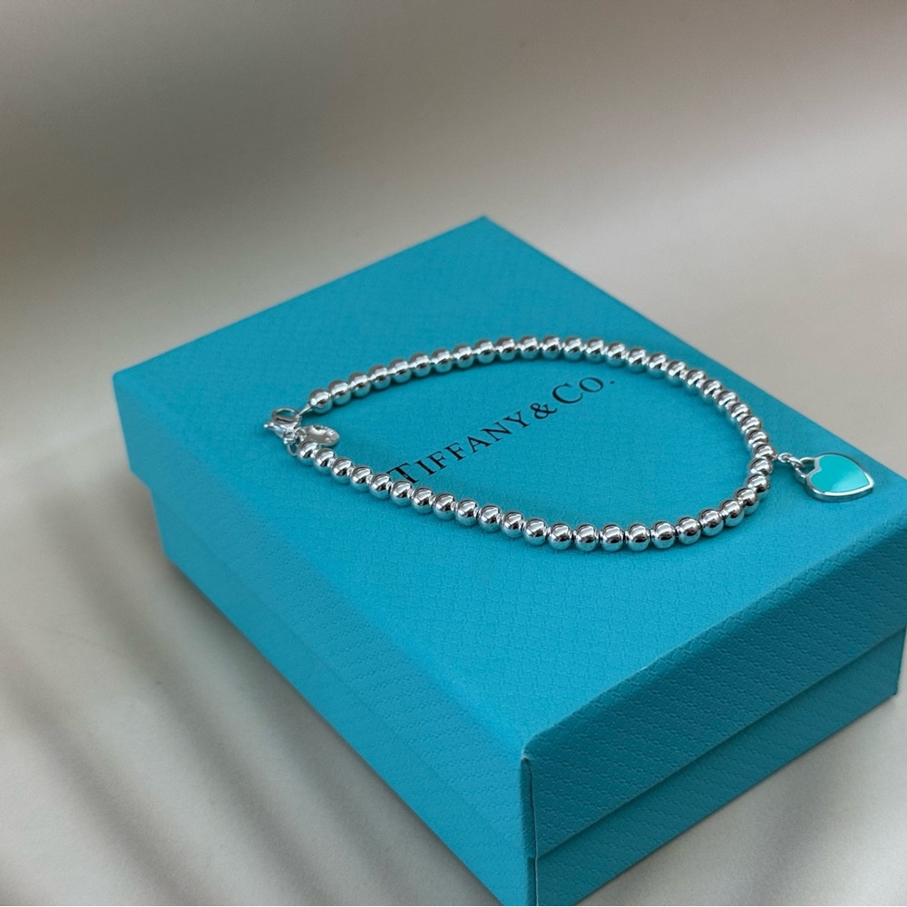 Tiffany & Co. Silver Bracelet with Blue Heart Charm